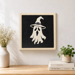 Finished witch hat ghost artwork displayed on a wall
