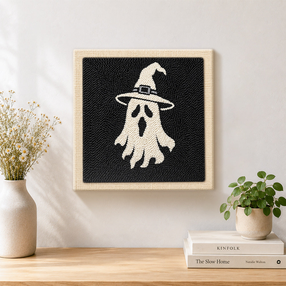 Finished witch hat ghost artwork displayed on a wall