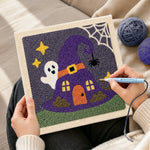 Creating handmade witch hat tiny house punch needle artwork