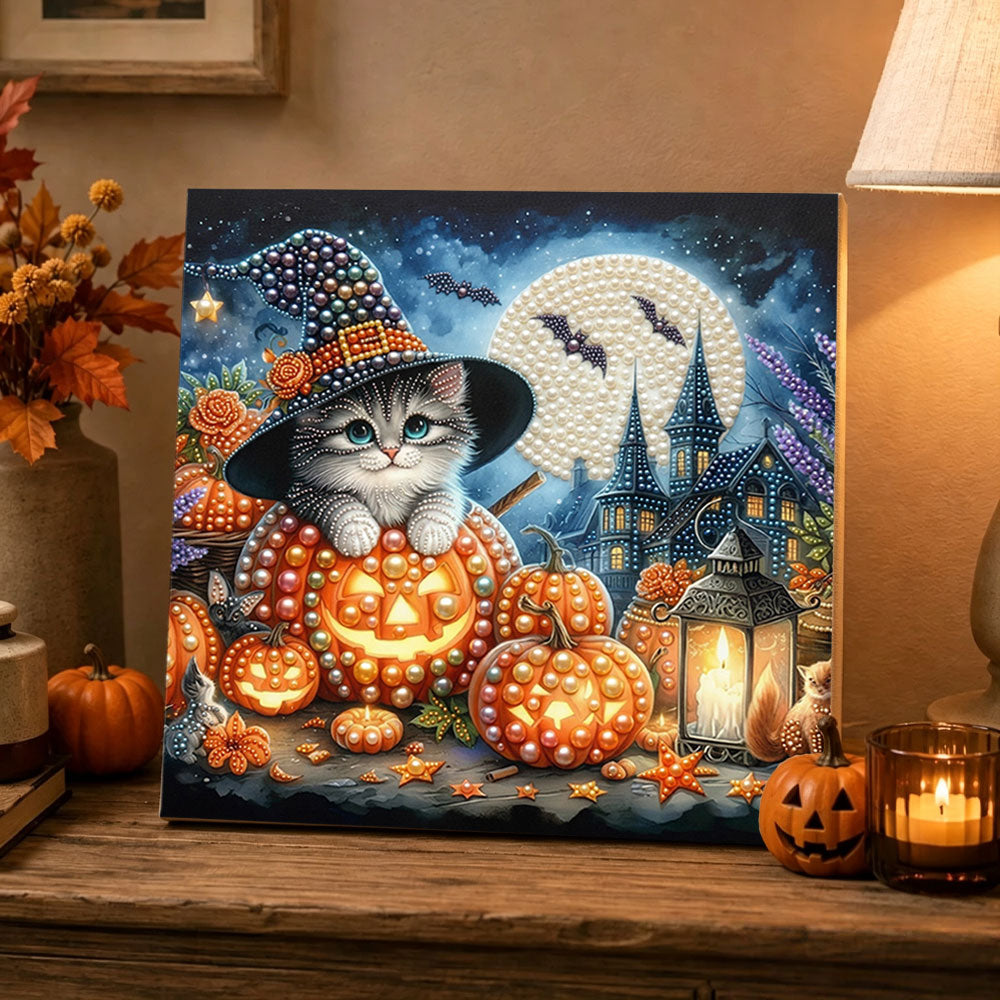 Finished witch kitten on pumpkin pearl diamond painting artwork displayed as holiday home decor