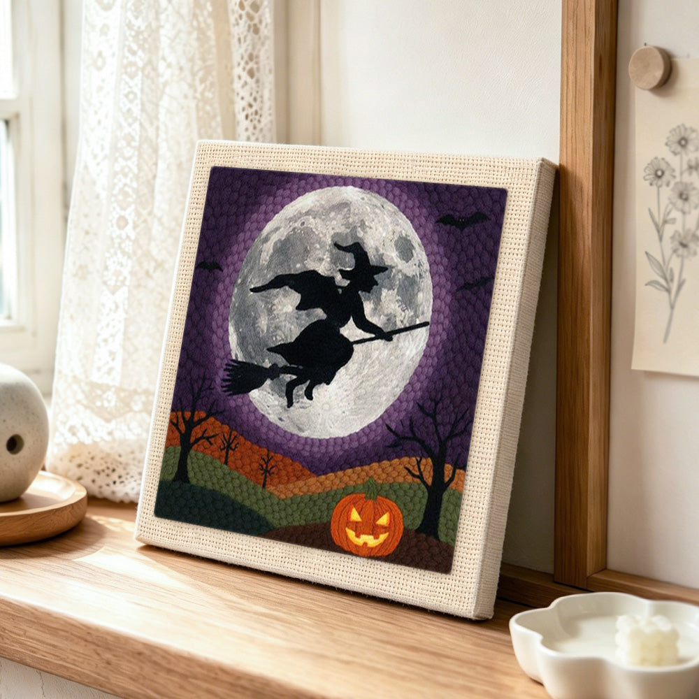 Witch moon flight punch needle artwork displayed on a table