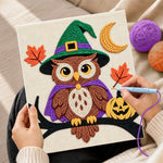 Creating handmade witch owl on branch punch needle artwork