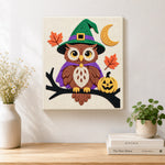 Finished witch owl on branch artwork displayed on a wall