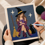 Creating handmade witch reading magic book with cat punch needle artwork