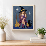 Finished witch reading magic book with cat artwork displayed on a wall