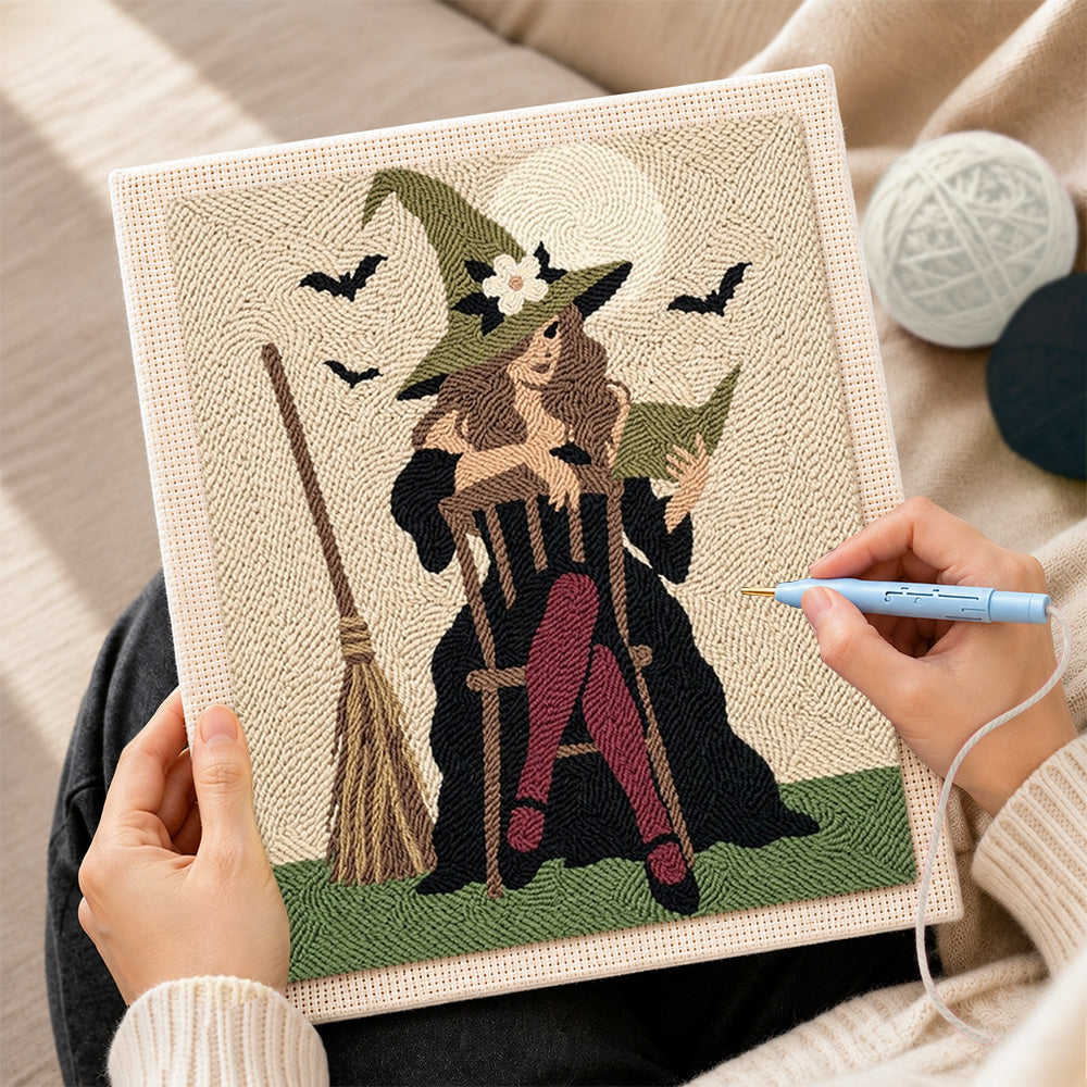 Creating handmade witch seated with spell book punch needle artwork