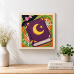 Finished witch spell book artwork displayed on a wall