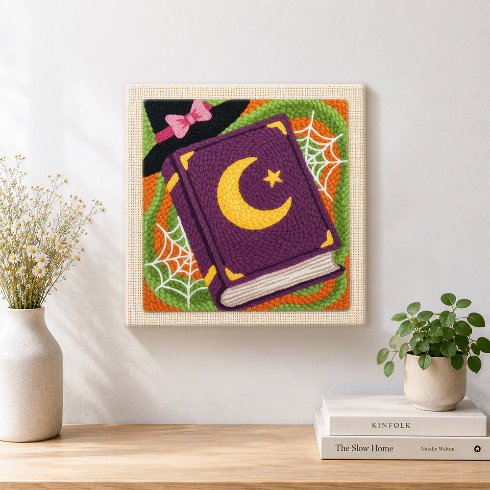 Finished witch spell book artwork displayed on a wall