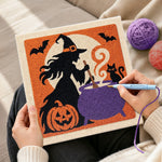 Creating handmade witch stirring magic cauldron punch needle artwork