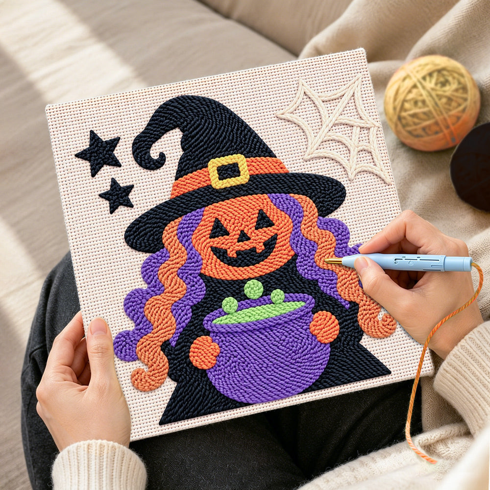 Creating handmade witch with magic cauldron punch needle artwork