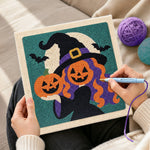 Creating handmade witch with pumpkin heads punch needle artwork