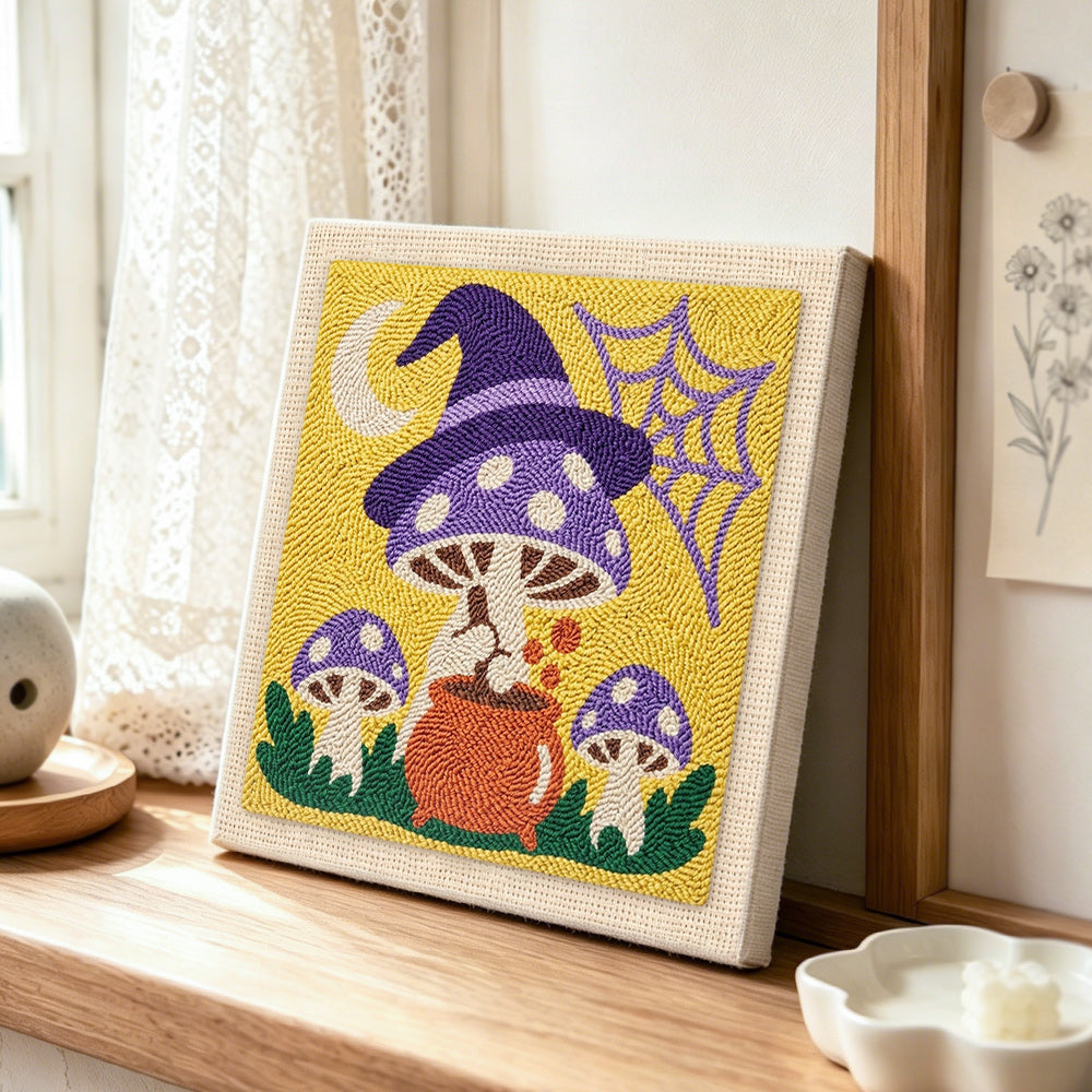 Witchy mushrooms punch needle artwork displayed on a table