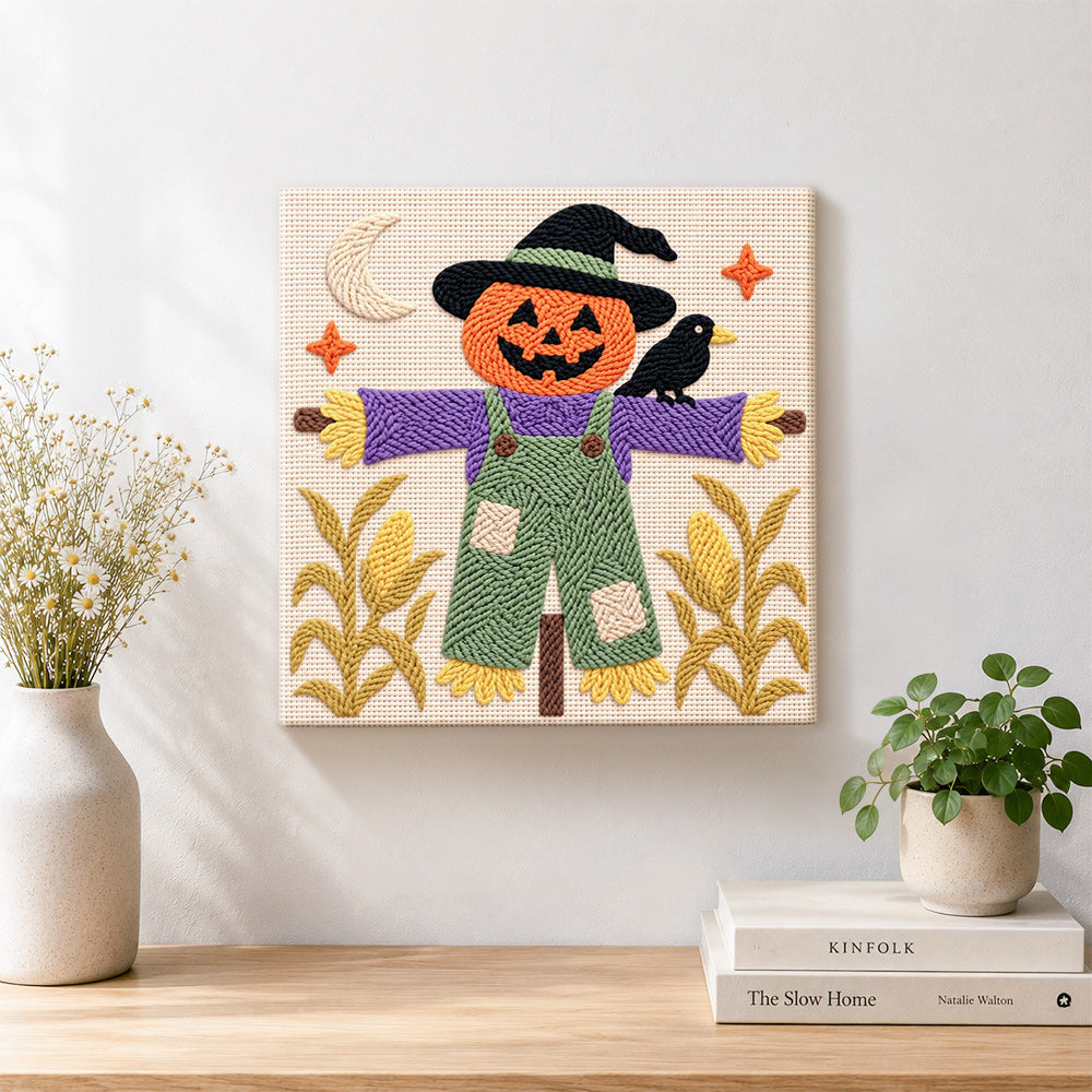Finished witchy pumpkin scarecrow artwork displayed on a wall
