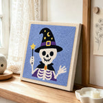 Wizard skeleton punch needle artwork displayed on a table