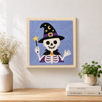 Finished wizard skeleton artwork displayed on a wall