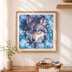 Finished wolf hidden in blue florals cross stitch artwork displayed as home decor