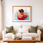 Finished woman holding fresh bouquet cross stitch artwork displayed as home decor