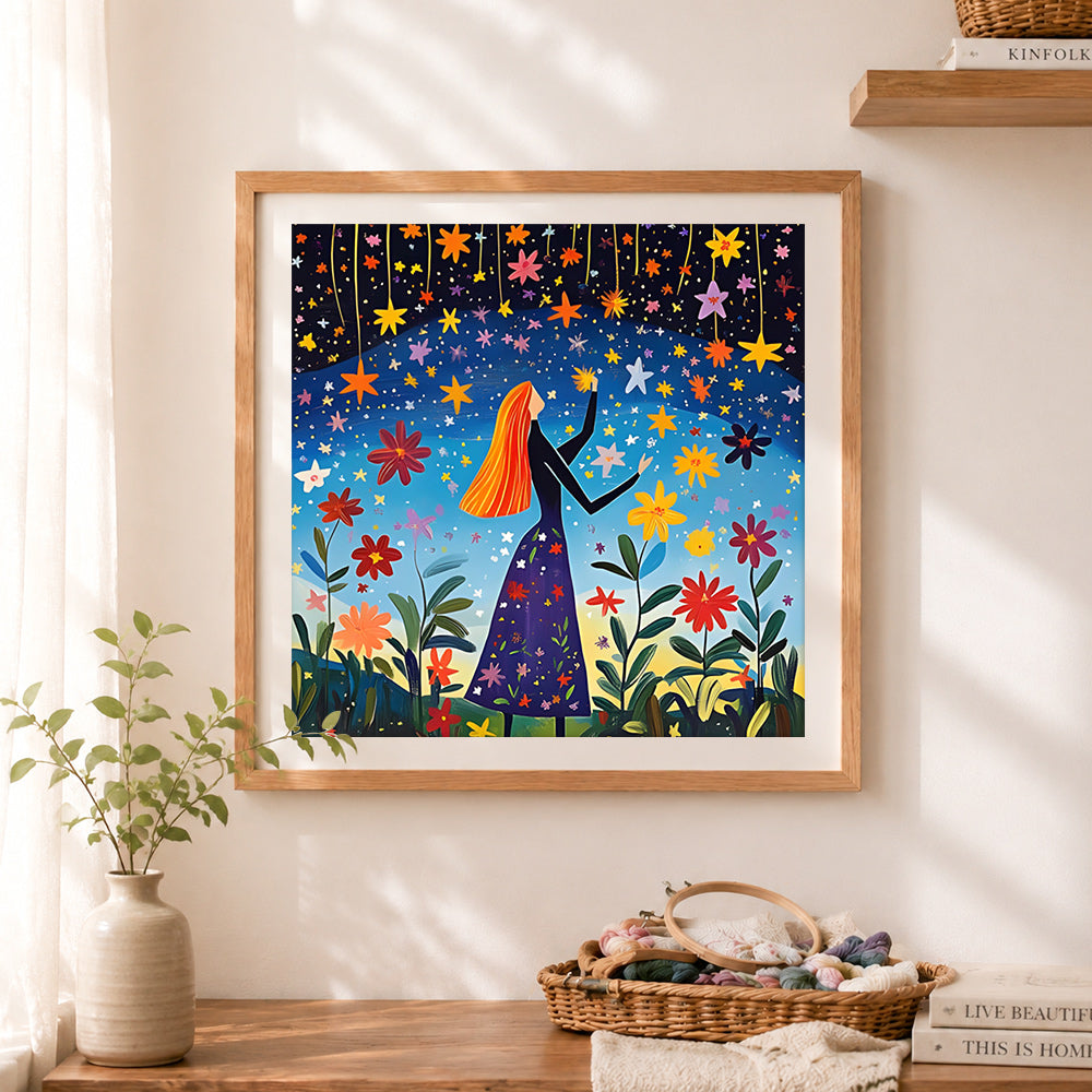 Finished woman reaching for stars in midnight garden cross stitch artwork displayed as home decor