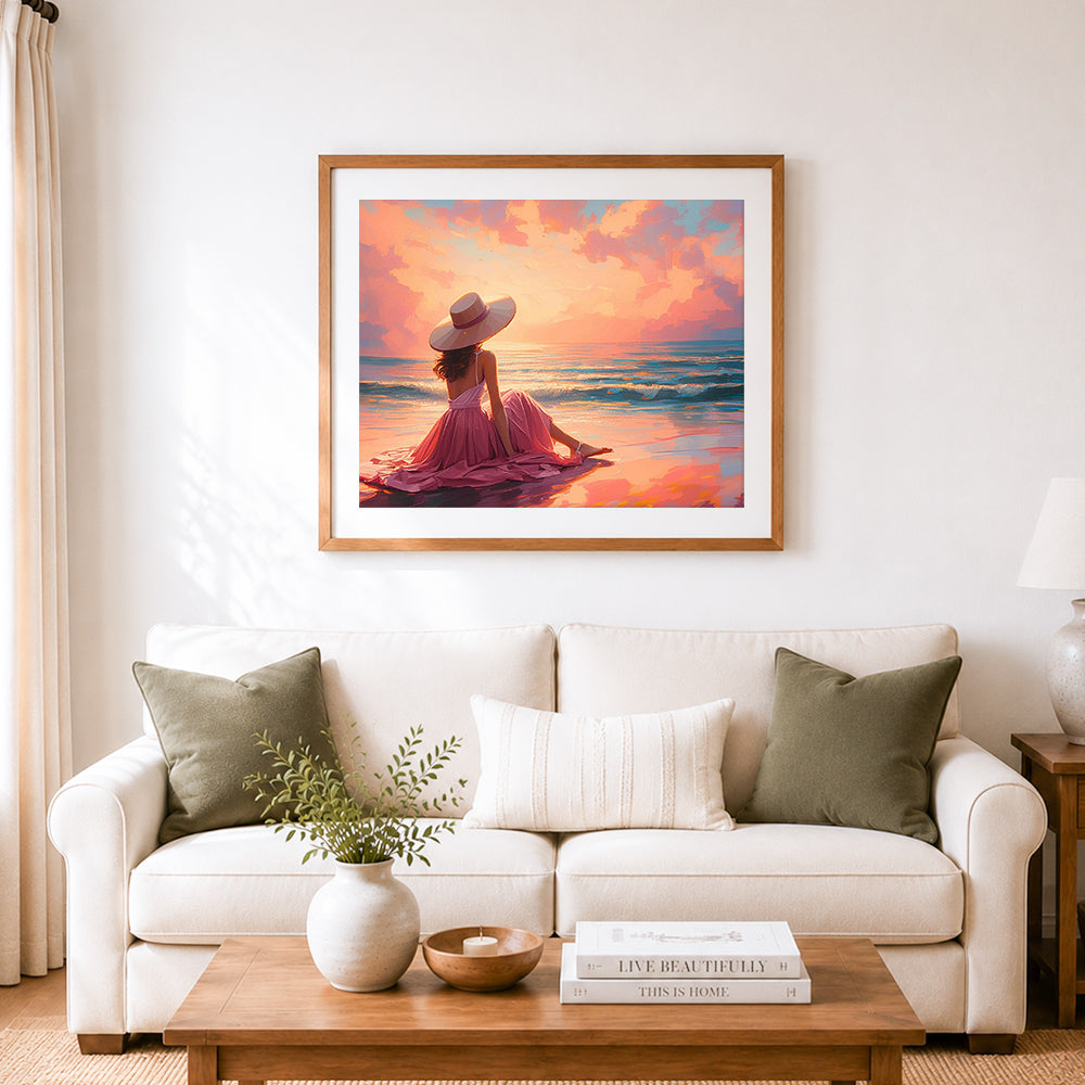 Finished woman watching sunset at beach cross stitch artwork displayed as home decor