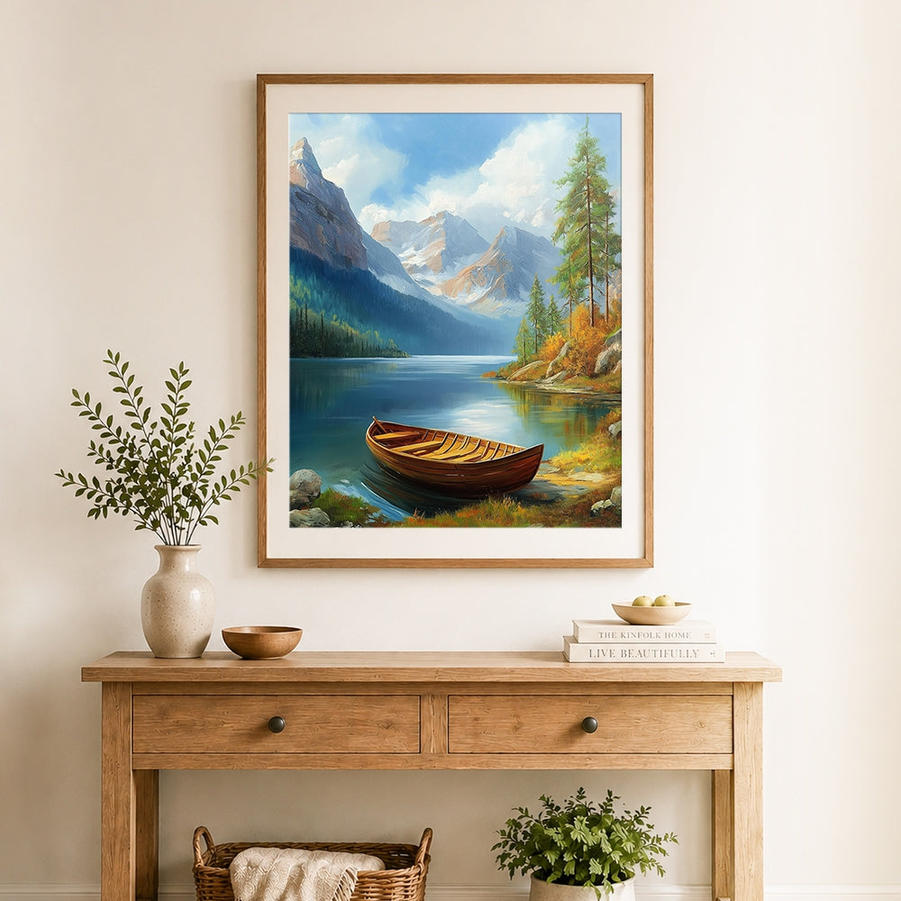 Finished wooden rowboat on turquoise lake with snowy peaks cross stitch artwork displayed as home decor