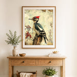 Finished woodpecker on a tree stump cross stitch artwork displayed as home decor