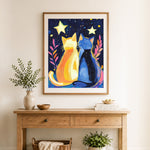 Finished yellow and blue cats under stars cross stitch artwork displayed as home decor