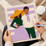Creating handmade yellow hat lady and scarf man punch needle artwork