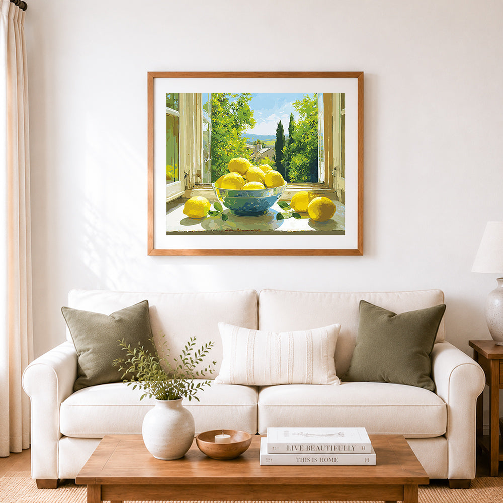 Finished yellow lemons in bowl on windowsill cross stitch artwork displayed as home decor