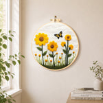 Yellow sunflowers with butterfly needle felt wall art displayed in a bright home interior