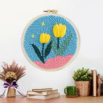 Finished yellow tulips on pink hills artwork displayed on a wall