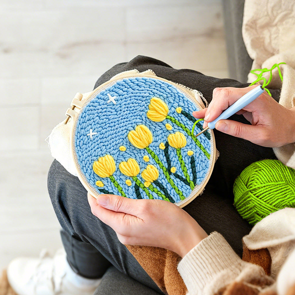 Creating handmade yellow tulips under starry sky punch needle artwork